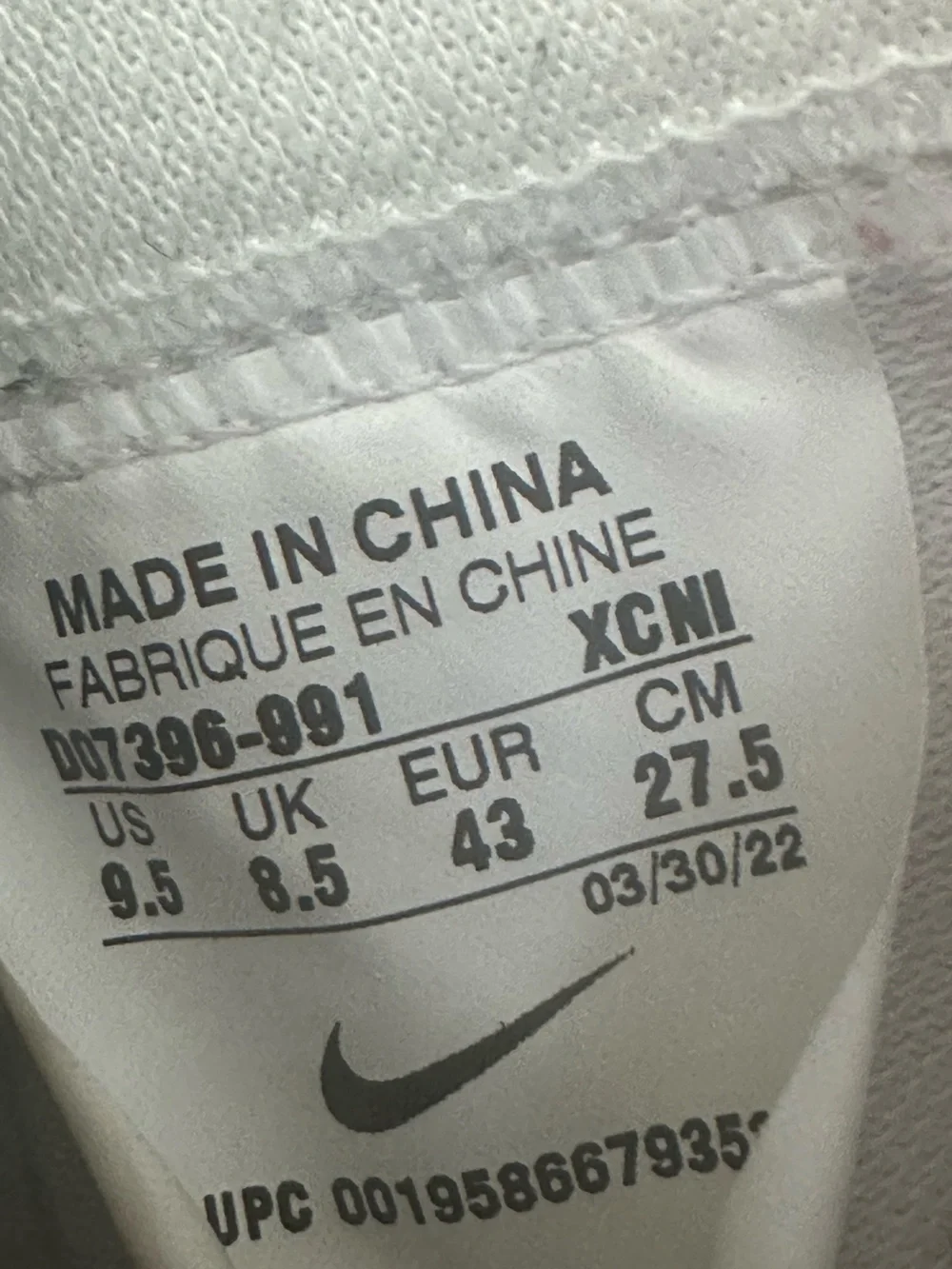 Nike White High-Top Sneakers with Blue Swoosh